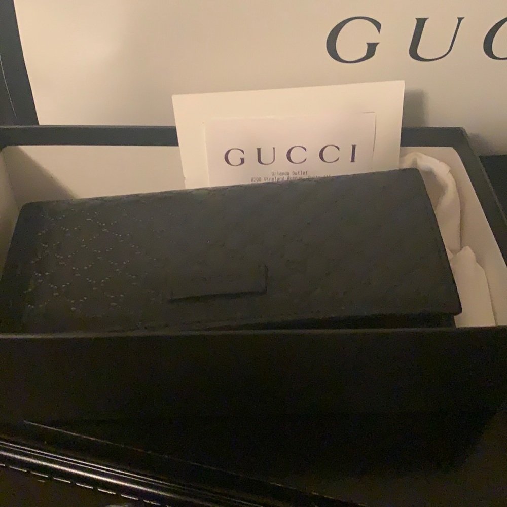 Black leather matching wallet to the purse